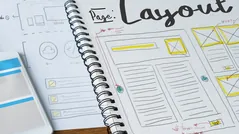 Website layout wireframe sketches in a notebook representing website design services